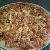 Pizza made out of multi grain dough topped with Parmesan and Mozarella cheeses, sliced black olives, and pepperoni.